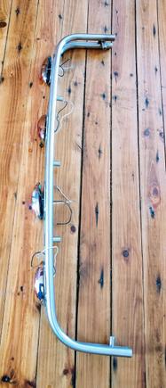 top view of bumper. short pipes attached are where the bolts will go through into the trunk