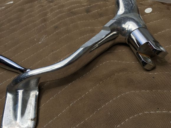 Grinding bottom of arm to clear exhaust.