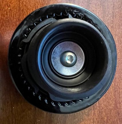 This is what the underside of the aftermarket cap looked like before modification.