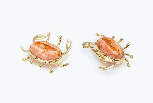 Fire opal crab pendant set in 14k yellow gold