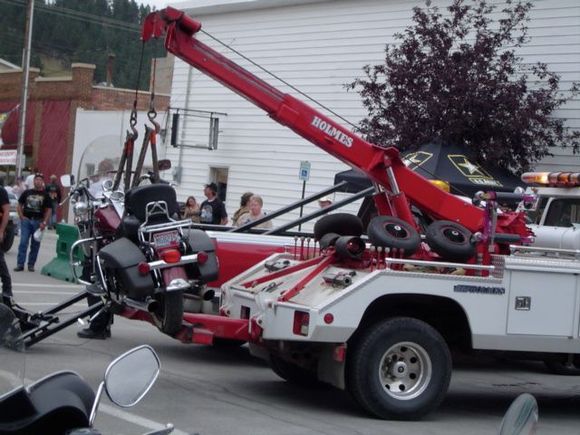 Someone's bike was parked illegally; now it is getting towed.