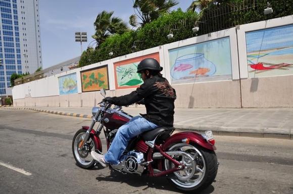 My mate on his nightster taking a pic of me while we cruise on the corniche (high shutter speed)