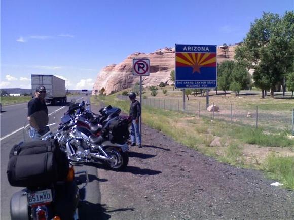 bikes in front of arizona sign