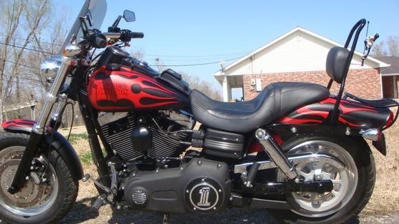 DSC01713 Harley FaBob sissy bar, Asshole mirrors from J&amp;P CYCLES. Fuse Box Trim,I ordered 2 battery box trim pieces off of a 2010 CVO FatBob put 1 on battery box and trimmed and rebent the other one to fit the fuse box cover it was a pain in the ass but i got it to fit and it looks nice even up close.