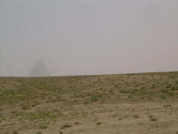 Shiprock N.M. Barley visible thru strorm