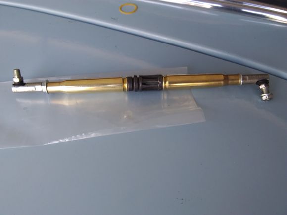 Military theme shift linkage. Two .50Cal rounds separated by an M16 flash suppressor.