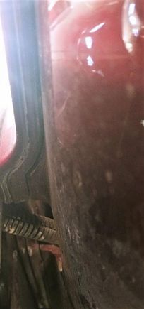 Picture was taken with camera on the floor, from underneath, looking up at the trunk. The far left is the fiberglass shell, then the "steel frame" which goes under and up (a little) the fender. the left side rear fender would be to the left, but is not in the picture. 