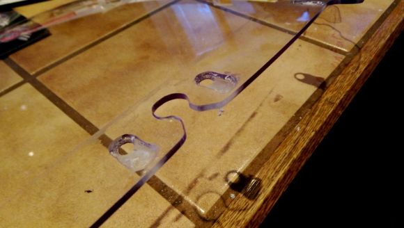 Provide clearance for wires to get below the seal area without pinching.  Used a dremel to rout about half way through.  I thought about just having slots, but then it would be trying to align the windshield with seven things, not just the three posts, and that would weaken it substantially  Had to remember to do it on the front