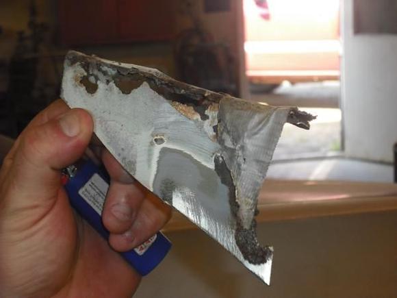 At some point someone had done a body job to the car and used a piece of duk tape to quick patch a hole and apply bondo over it, Nice!