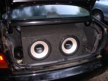 2 12'inch infinitys,rockford 1000watt amp pushen them,500watt rockford pushen my pioneer crossovers in the front and pioneer 6x9s in the back,might be puttin my 3 12inch rockford punch he2's in it....still thinkin alot of poundin but alot of weight...