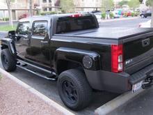 Extang Solid Fold bed cover, black gas cover, black powder coat nerf hitch step bar, tailgate lock