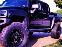 Blacked out! I have bedlined the fenders and vinyl wrapped the grill but before you freak out know that I plastidiped the fenders first before the bedliner.  It is removable back to factory.