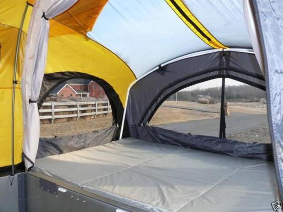 INSIDE SHOT, NOTE THE STAR VEIW FROM THE BED WITH THE RAIN FLY FOLDED BACK.