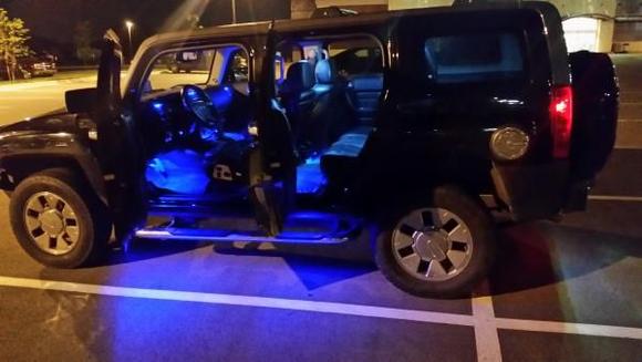 Just finished the blue LED under door lighting trim on all four doors. It's WAY brighter than my customs guy or me thought it would be. This picture in a well lit Sprouts parking lot shows how much pavement gets lit up when you open the doors.