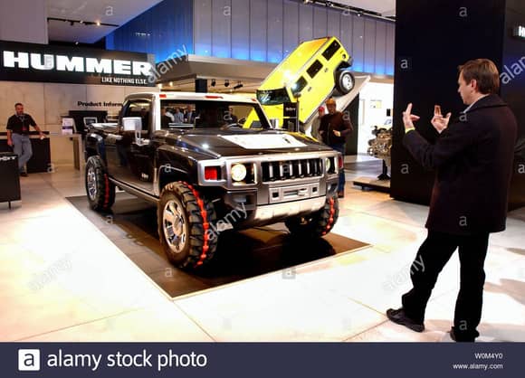 The Hummer H3T concept vehicle rolls into position on the General Motors stand for the North American International Auto Show in Detroit Tuesday, January 13, 2004. Unveiled at the Greater Los Angeles Auto Show in December, the H3T was specially flown in from California due to public demand, General Motors said. 