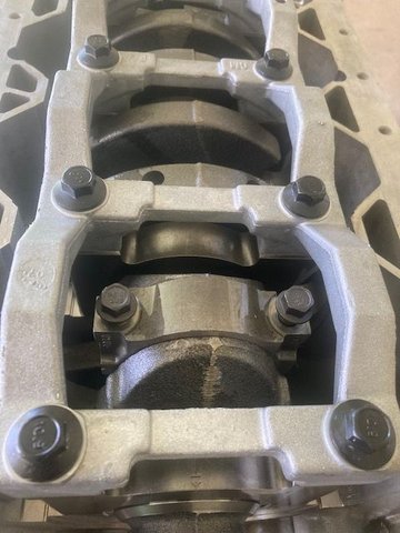 Installing new bolts.  The connecting rod bolts are first tightened to to 18 ft-lb, then an additional 110 degrees.  Do not reuse connecting rod bolts.  