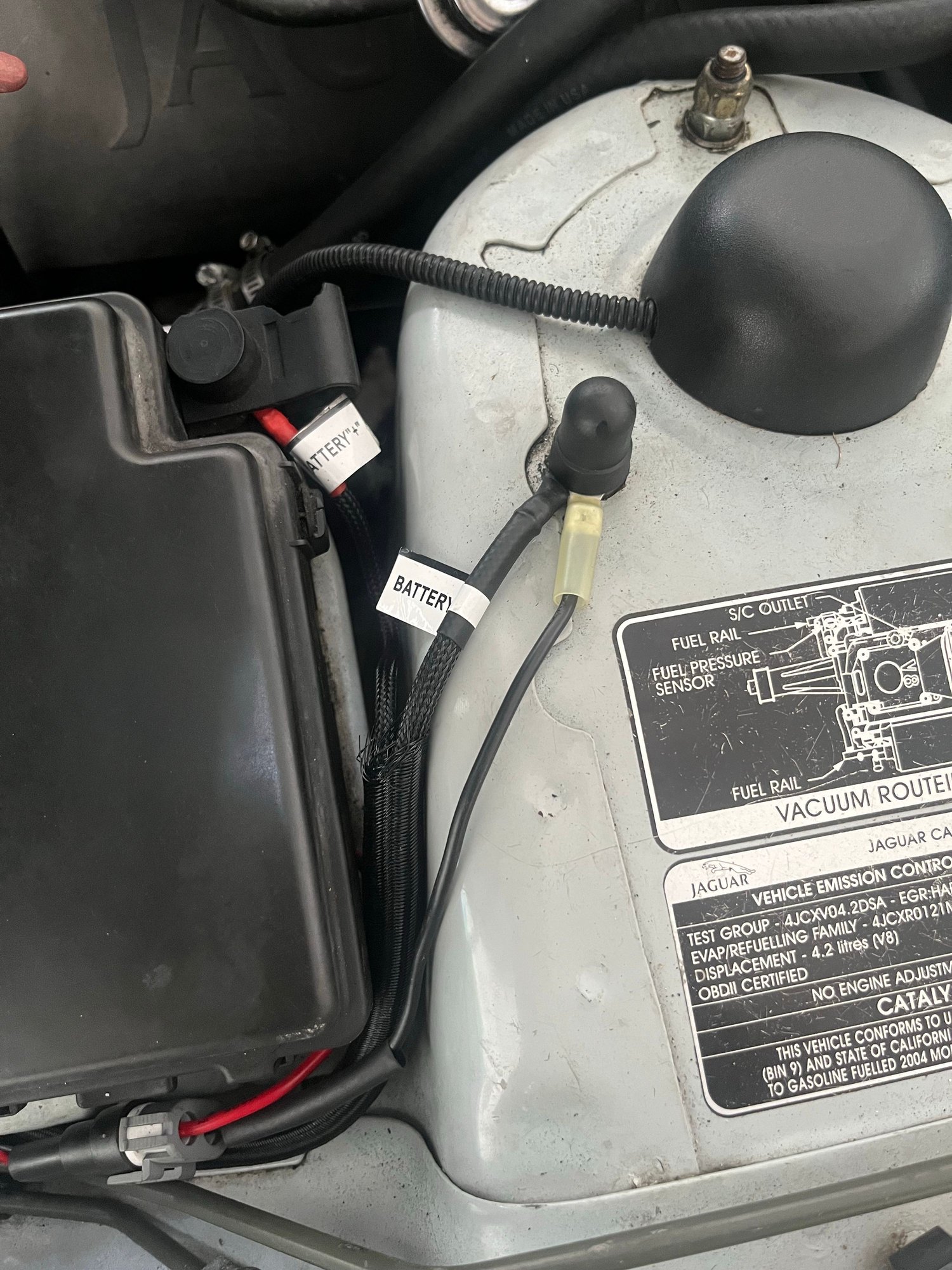 The harness itself also has a positive to battery and negative to ground terminals. I attached the positive boxs positive strap bolt, and the ground to a shock tower bolt. 