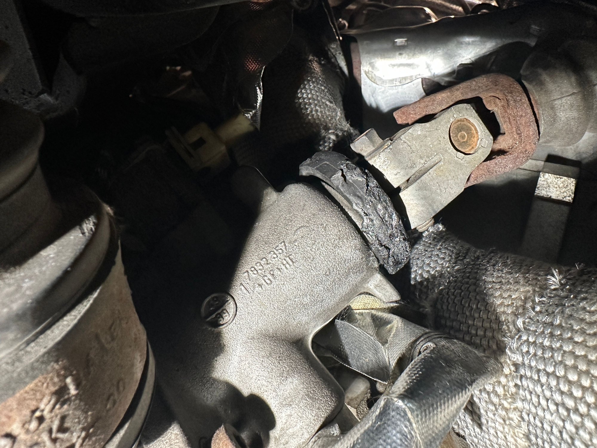 This is the collar that I noticed as getting heat damaged, and the visible side faces the downpipe when the steering wheel/gear is oriented for straight ahead travel.