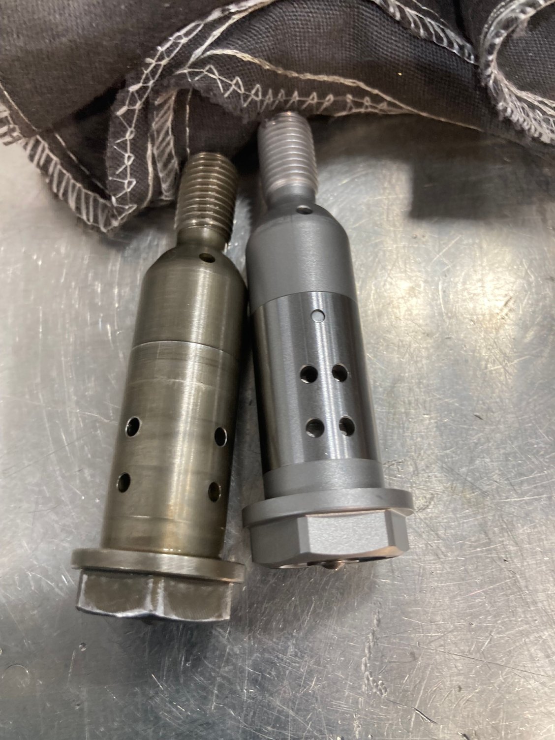 You can see the location of the 4 holes has changed. 