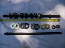 both compressors side by side, one assembled, 2nd showing the order of assy