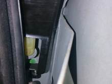 this yellow nylon part moves up and down when key turned, I geuss it is the lock cylinder rod. It is inside this black plastic part and I cant figure out what to do next.