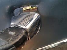 cover the leather door handle with tape before sliding back the chrome cover