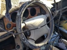 I believe that the steering wheel you have now looks better than this one.