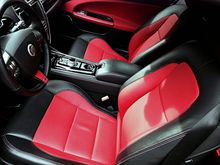 added Red leather inserts, doors, seats, and bottom of steering wheel