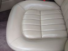 Front bolsters and knee padding were cracked and wrinkled.  Still some wrinkles, but the cracks are filled and leveled.  You really have to look closely to find where they were.