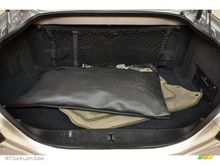Trunk with changer and amp on right. 