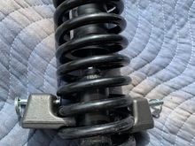 Spring is assembled on to the shock, but now it’s impossible to remove the clamps! 