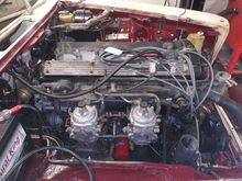 This is how the engine appears now. See the emission lines and how they attach to the carbs? Also note the thermostatically-controlled vacuum port near the front of the engine.