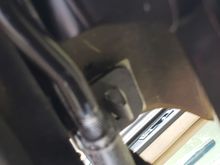 Push type fastener, end-most on side of panel/cover.