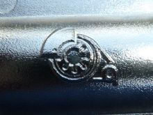 Manifold casting marks, this symbol on the upper casting, and embossed, XF 23/07 ON THE LOWER casting