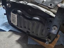 Drain plug on top (just above black panel) and offset a bit to the left