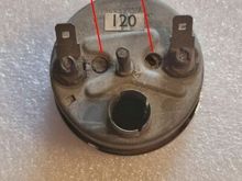 The two corks on the back of the gauge. You may have to remove the bracket to access them.
