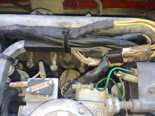 Center of frame are four beige wires that route to loose spades.