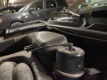 Cap on APP. Vacuum tube point forward. Remove tube and spray cleaner into cap. A fine spray tube helps. It will take only a small amount. Careful - the cleaner is very flammable. Do not do in a hot engine.