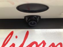 there's the tiny camera. smaller than trunk pop button