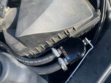 Up close, near drivers side air intake. Used aluminum rivets to install the retaining bracket.