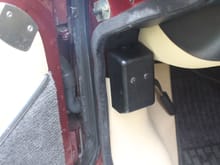 This is the 'Cut Out' that shuts the Car down in the event of an accident.
Push the blunt end of a pencil down the hole of this cover in order to Push down the Button Inside and re-lock it.