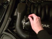 This is the general location of the vacuum T-fitting on the passenger side at the back of the engine bay