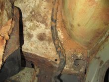 bundle on left side now passes along inside of sill in depression to front of car