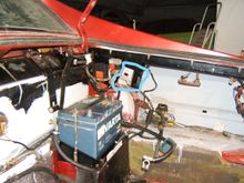 The standard Lucas ECU is fixed just inside the black RHS strengthener bracket, and can partly be see here marked up.