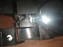 You can see where the metal broke at the point of cable attachment.