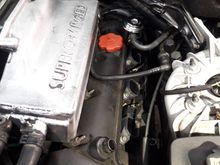 Distant photo, showing location next to oil filler cap