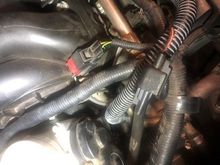 Connector on the right above right rear of cylinder head not plugged into anything