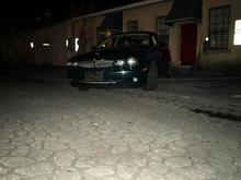 My 2004 X-type in Savannah on a backroad on River street at night.