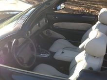 image we oatmeal leather interior. Leather seats and console with black stitching and piping and matching suede door inserts.