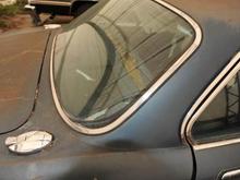 Side of rear glass you can see the rear seats are ripped